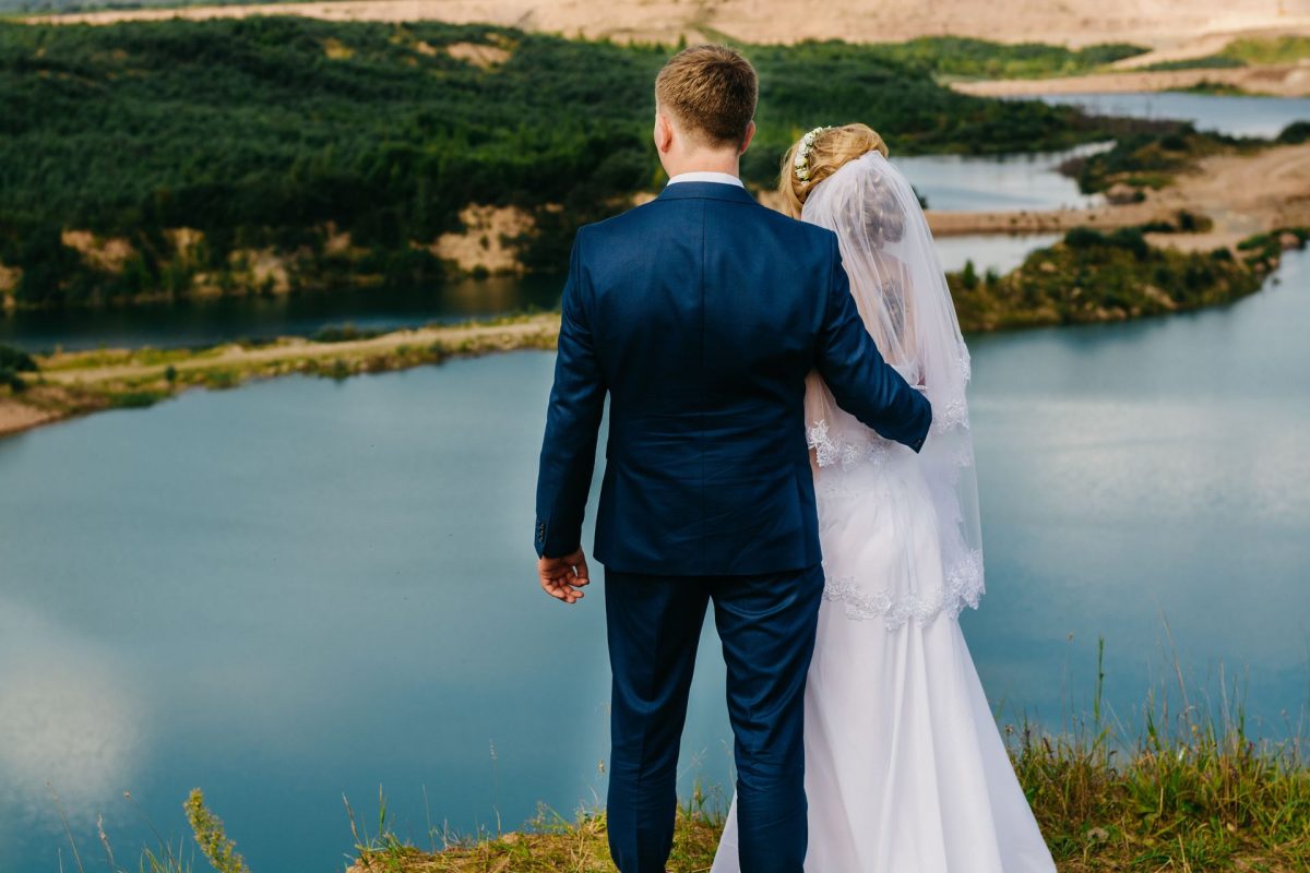 newly weds overlooking the lake